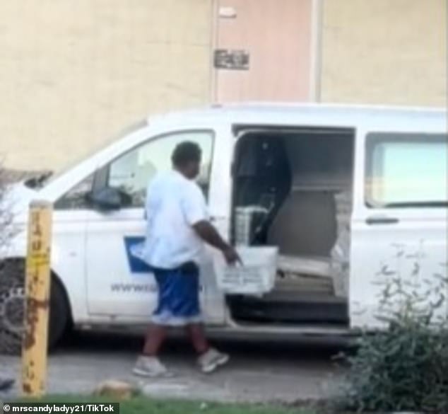 The alleged postal worker threw the mail into the front of the van, before retrieving even more mail from the back of the vehicle.