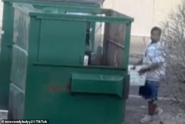 After the alleged USPS worker threw out the mail, he leaned over the dumpster and appeared to try to bury the letters under other debris.