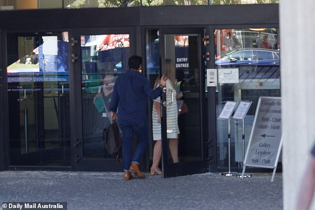 The couple are not in the French capital to watch the Olympics, but instead took a three-hour train into the city to sign an affidavit (pictured: entering the Australian embassy)