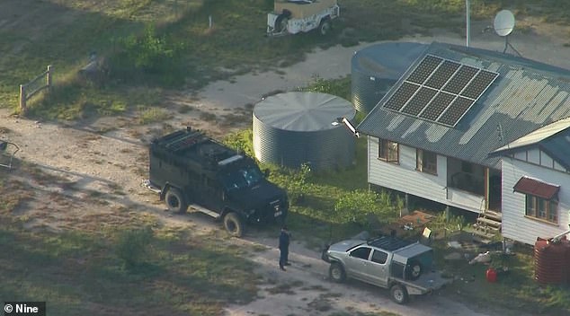 A barricade of logs and metal had been placed in the driveway about 100 metres from the house, stopping the heavily armed police BearCat vehicle which was then attacked.