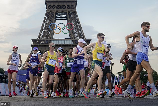 Australians Declan Tingay and Rhydian Cowley (in yellow jerseys) are pictured competing in the men's race walk in Paris, the race that prompted Alcott to joke with fans.