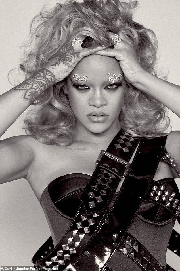 In another look, Rihanna sported a black corset while having two studded black belts around her shoulders.