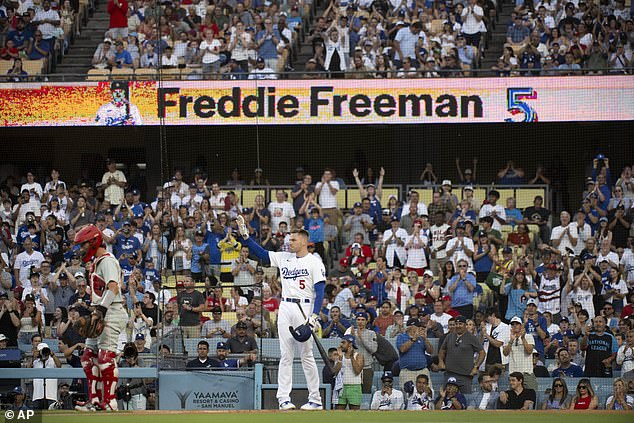 Los Angeles Dodgers' Freddie Freeman waves to the stands during the first inning