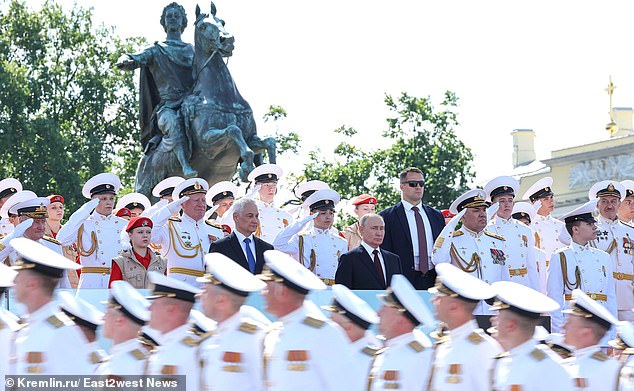 Putin and Belousov attend the Navy Day parade on July 28. Moscow says information obtained indicates that Ukraine was seeking to kill both men