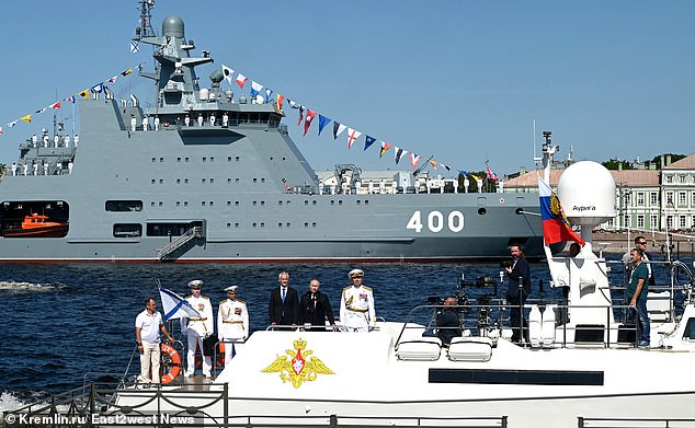 Putin and Belousov pose on a ship at the annual Navy Day parade on July 28, 2024