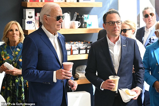 U.S. President Joe Biden, First Lady Jill Biden (L) and Pennsylvania Governor Josh Shapiro (R) visit a coffee shop in Harrisburg, Pennsylvania, July 7, 2024.