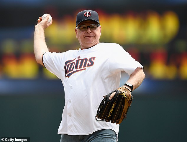 Walz is an avid sports fan, as seen here throwing out the first pitch at a Twins game in 2019.