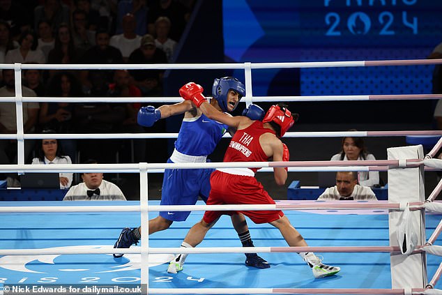 The 25-year-old Algerian boxer won the fight (pictured above) by unanimous decision.