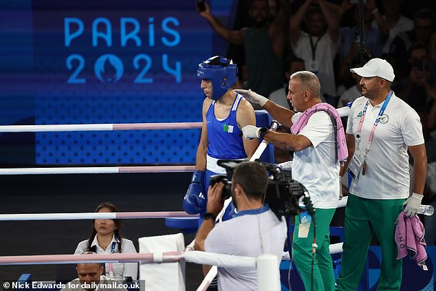 Algeria's Imane Khelif cools down as she battles Thailand's Janjaem Suwannapheng in their 66kg women's boxing semi-final bout