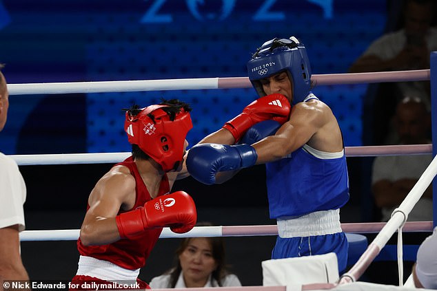 Imane Khelif gets hit in the face by Janjaem Suwannapheng during the women's 66kg boxing semi-final