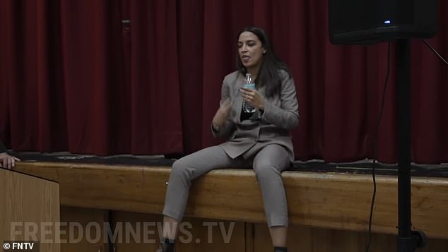 At her October 2022 event in her congressional district, AOC is seen sitting with her legs spread, though no significance was given to this at the time.