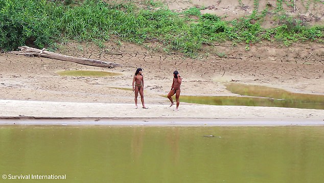 The images showed the group standing near the Las Piedras River in small groups, some jogging to pick up large spears that were lying on the ground.