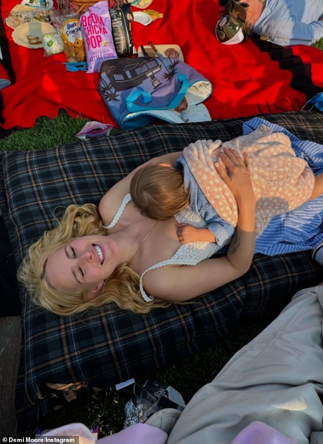 Demi's eldest daughter, Rumer Willis, cozied up to her 15-month-old daughter while enjoying the free 40th anniversary gala concert featuring 19-time Grammy Award-winning cellist Yo-Yo Ma.