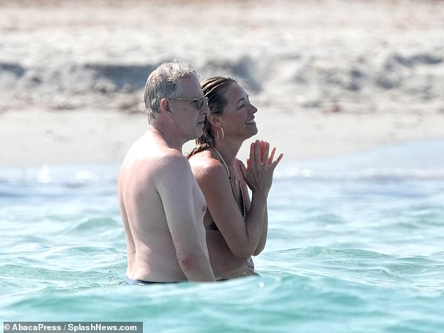 Cat looked gorgeous as she and husband Patrick Kielty, 53, cooled off in the Mediterranean during their day at the beach.