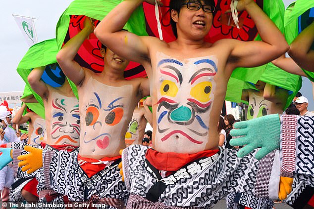 Could you stand it? Japan's belly button festival (pictured) is held every July in Furano, Hokkaido