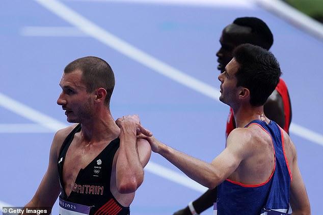 Hugo Hay of Team France and George Mills of Team Great Britain chat after the race.