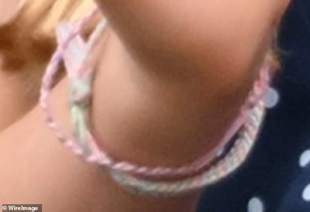 Charlotte wore two of the thread bracelets, one with various shades of pink and another with green, blue and pink fabric.