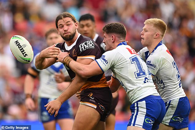 Pat Carrigan of the Broncos offloads during the Brisbane Broncos vs Canterbury Bulldogs match at Suncorp Stadium on July 27, 2024 in Brisbane.