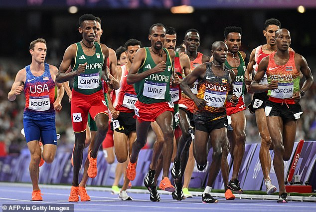 Girma (second from left) before his worrying crash in the 3000m steeplechase pack