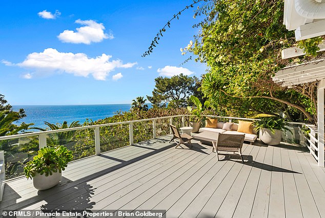 Built in 1960, the 3,713-square-foot home is steps from the beach, featuring a pool, spa, guest house and a patio with a beautiful ocean view.