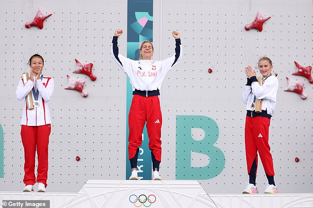 The women's speed climbing medallists pose together on the podium. Miroslaw (centre) won gold, Deng (left) took silver and Kalucka bronze.