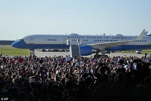 The crowd went wild when Air Force Two arrived; Donald Trump also used his Air Force plane to get to rallies when he was president