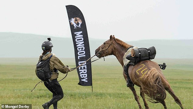 Riders ride across the Mongolian steppe on horses 