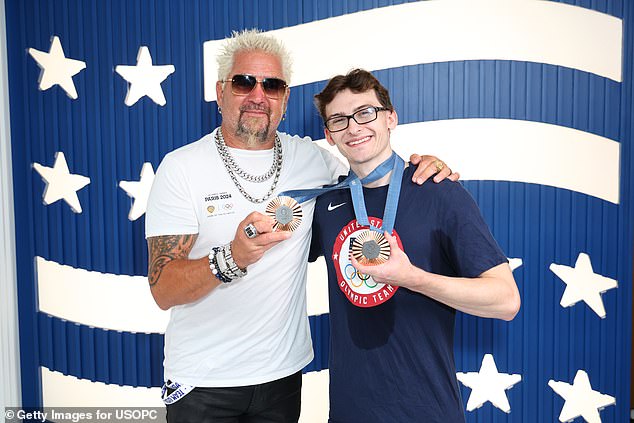 The 25-year-old pommel horse boy even got to pose for a photo with celebrity chef Guy Fieri.