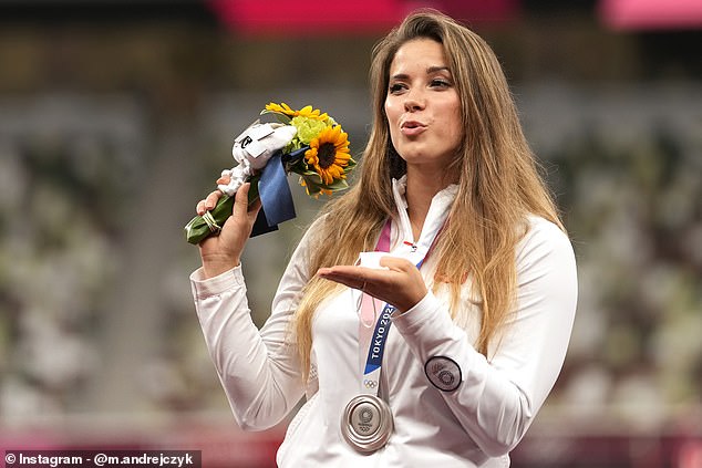 Maria posing on the podium during the medal ceremony for the women's javelin throw at the 2020 Summer Olympics