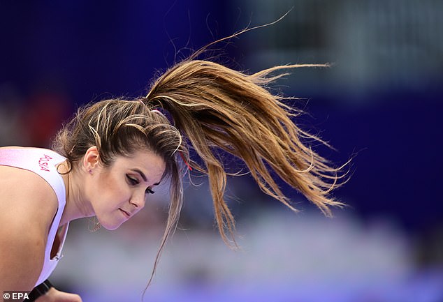 Maria is seen pushing back her long, fluffy hair. She will compete for the second and final time at the Stade de France stadium during the Paris Games in the women's javelin throw final on Saturday.