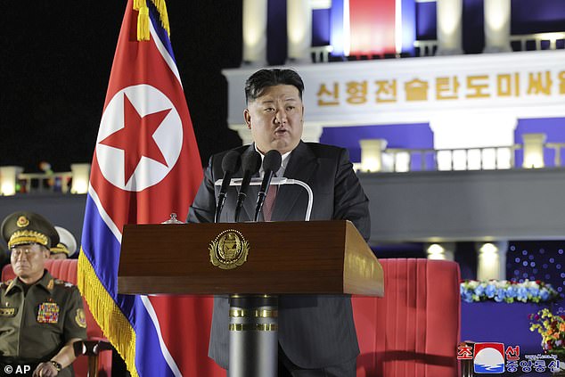 Kim Jong Un speaks during a ceremony to mark the delivery of 250 nuclear-capable missile launchers to frontline military units on August 4.