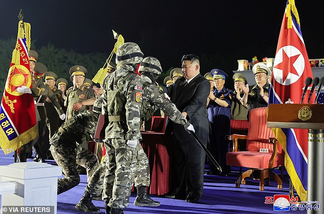 Kim Jong Un during a ceremony to mark the delivery of new tactical ballistic missiles at an undisclosed location on August 4.