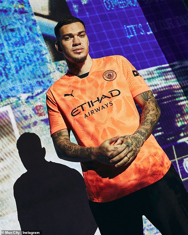 Ederson was also pictured modelling the goalkeeper's shirt, which comes in a bright orange colour.