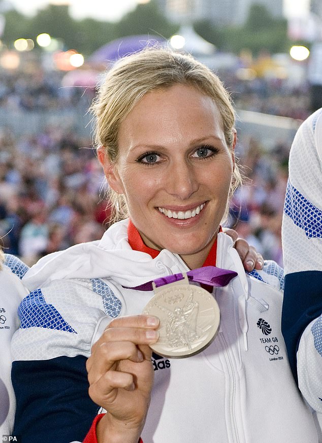 Zara Tindall, pictured, of the British Equestrian Team shows off her silver medal in Hyde Park in London in 2012