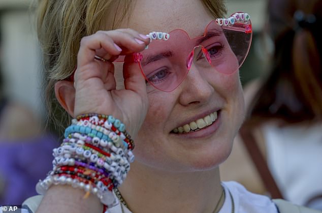 Jenny, a Swift fan from Vienna, exchanges bracelets in the city centre