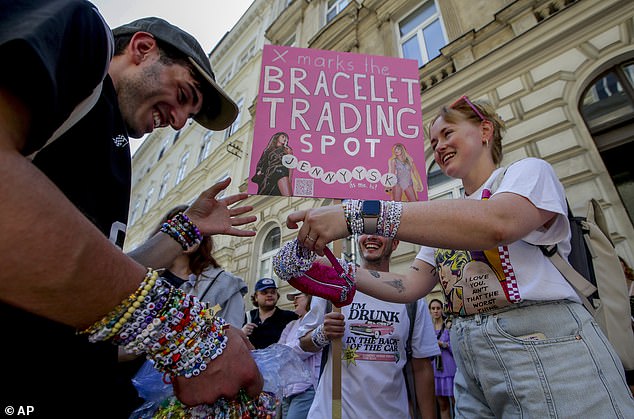 Swifties exchange bracelets in the centre of Vienna