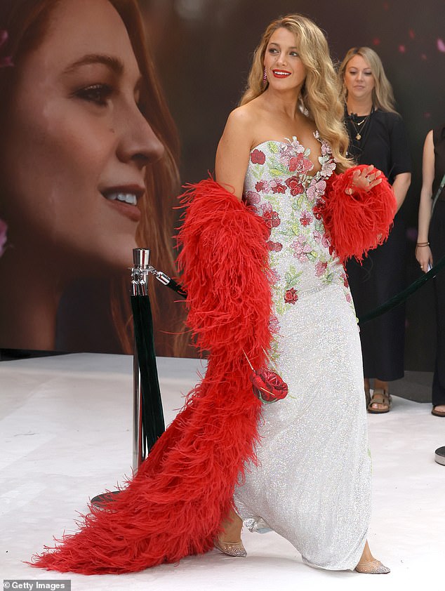 Sparkling silver heels peeked out from beneath the floor-length hem as she walked down the white carpet.