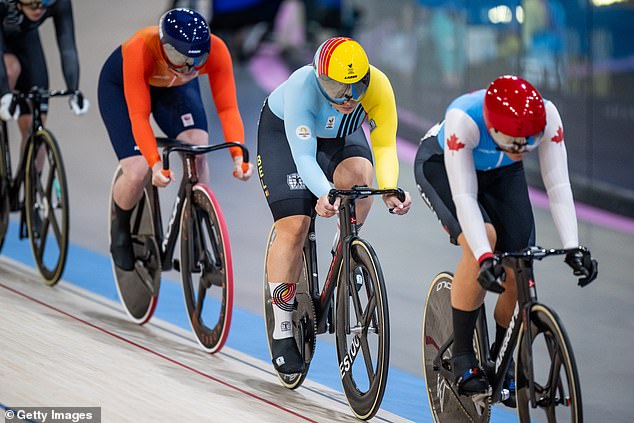 The women's keirin race was going smoothly until Van der Peet's bike (orange) slipped out from under her.