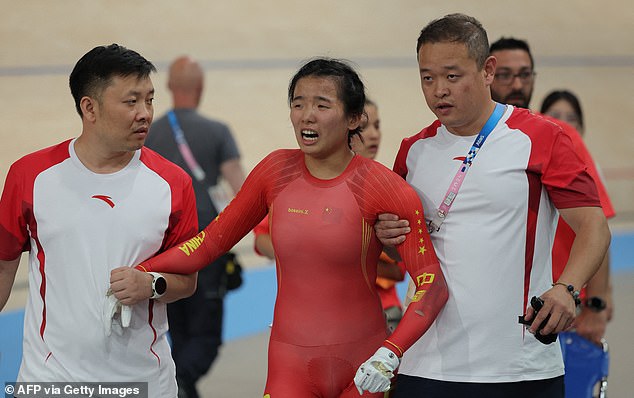 China's Liying looked visibly upset as support staff helped her off the court.