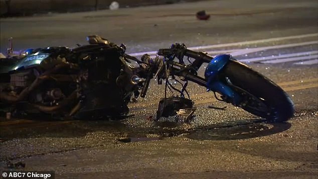 A single police officer could later be seen tentatively approaching the motorcyclist with a flashlight and removing what appears to be a firearm from the man's body, placing it several feet away from the deceased man.