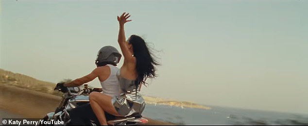 The nearly four-minute music video captures a bikini-clad Perry partying on the Spanish island with her real-life friends and fans.