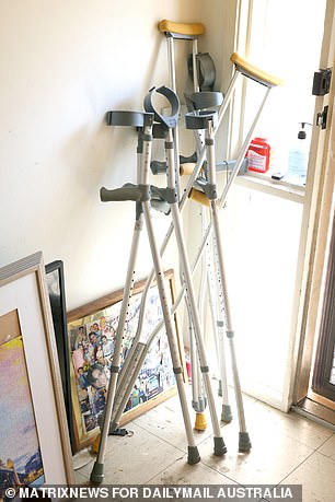 John's walking sticks leaning against the door of his home where he lived with his late father, George