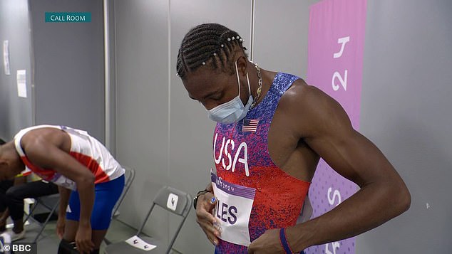 Lyles was seen wearing a mask in the moments before his competition began in Paris.