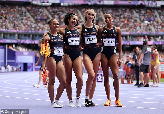 PARIS, FRANCE - AUGUST 09: Yemi Mary John, Hannah Kelly, Jodie Williams and Lina Nielsen of Team Great Britain react after competing in the first round of the Women's 4 x 400m Relay on day fourteen of the Paris 2024 Olympic Games at Stade de France on August 09, 2024 in Paris, France. (Photo by Hannah Peters/Getty Images)