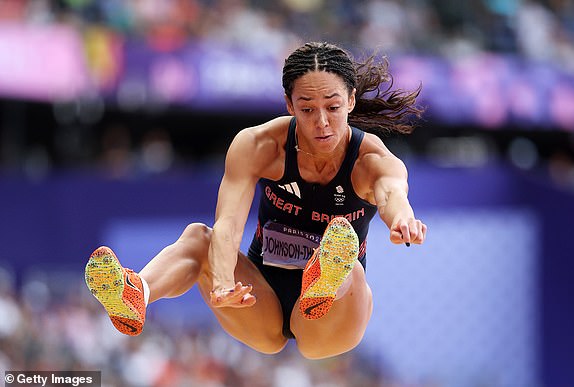 PARIS, FRANCE - AUGUST 09: Katarina Johnson-Thompson of Team Great Britain competes during the Women's Heptathlon Long Jump on day fourteen of the Paris 2024 Olympic Games at Stade de France on August 9, 2024 in Paris, France. (Photo by Cameron Spencer/Getty Images)