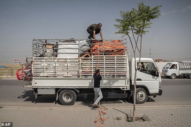 Yazidis from Khanke prepare to return to their homes in Sinjar on June 24, 2024