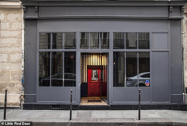 Red Door - Paris: Visitors can enter through a side door located to the left of the red door seen in this image.