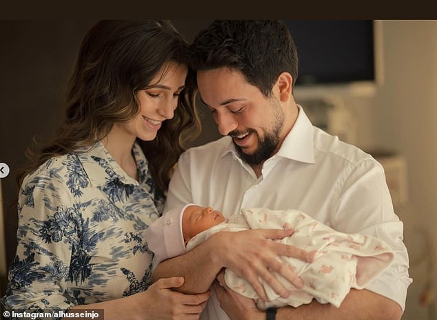 In the second photo shared on Instagram, the proud parents looked in awe at their newborn daughter.