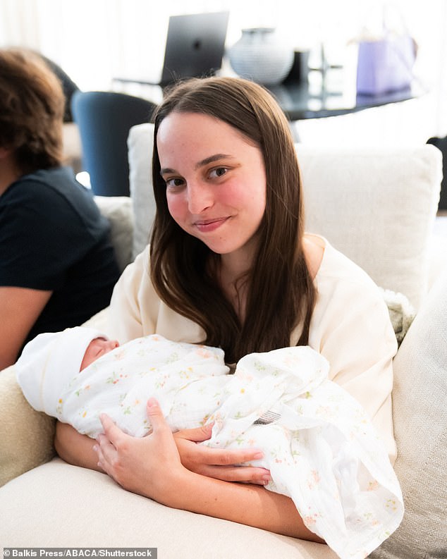 Princess Salma Bint Abdullah (daughter of King Abdullah and Queen Rania) holds her first niece, Princess Iman (Bint Al Hussein), daughter of her brother Crown Prince Hussein (or Al Hussain), and Princess Rajwa.