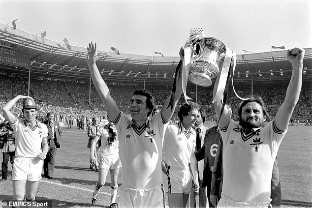 Brooking (centre) lifts the FA Cup alongside Frank Lampard Snr, father of the future Chelsea great